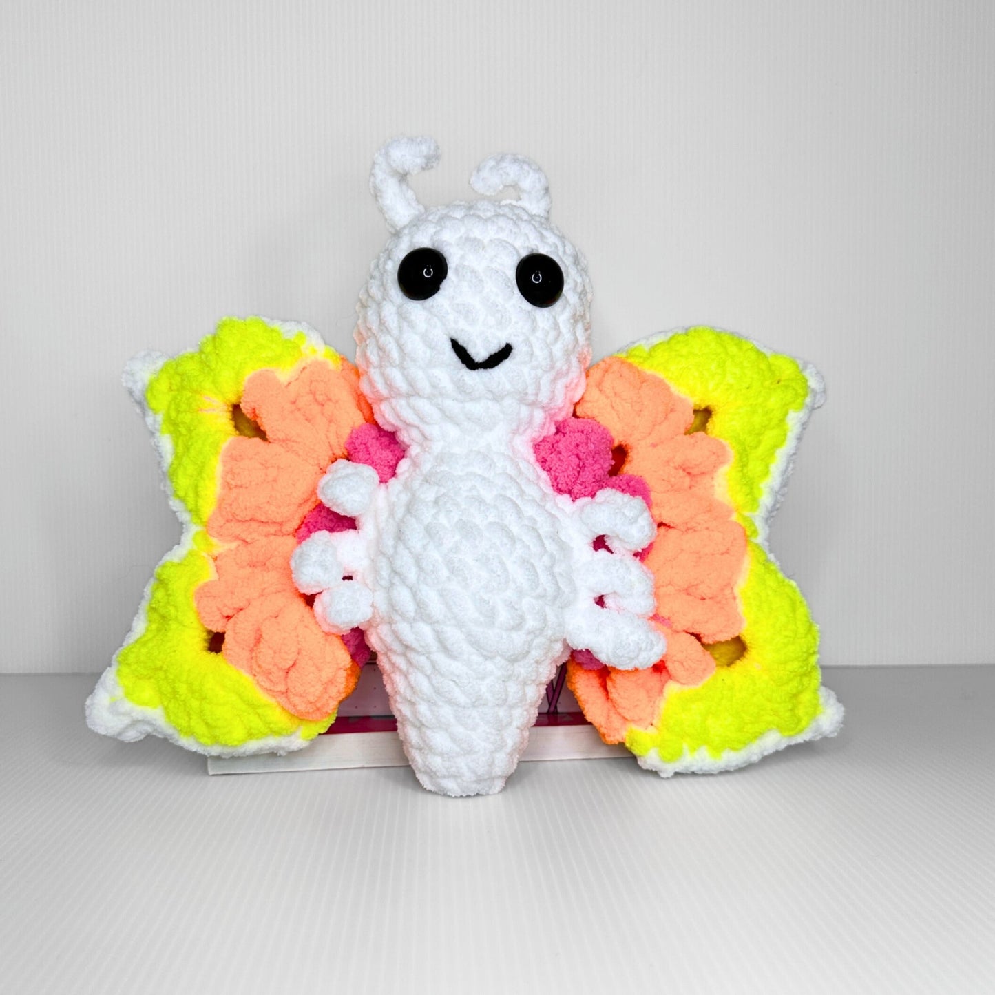 Handmade Granny Square Butterfly Crochet Plush — Neon Multicolor Patterned Wings in Chunky Yarn - pursuitofcraftyness