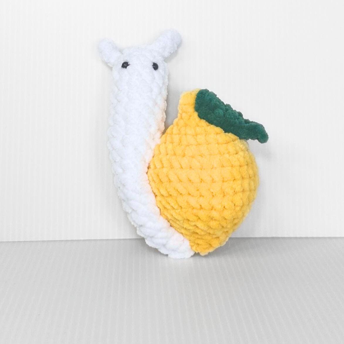 Crochet Fruit Snail Plushie Set: Handmade Whimsical Collection - pursuitofcraftyness