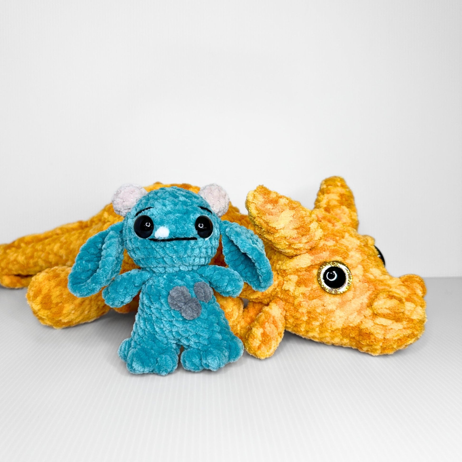 Handmade Golden Feathertail Dragon Crochet Plush — Large Laying Fantasy Dragon in Warm Gold Velvet Yarn - pursuitofcraftyness