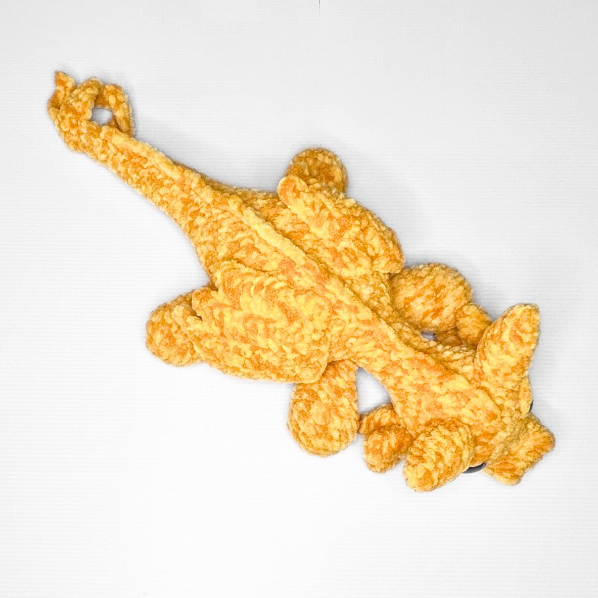 Handmade Golden Feathertail Dragon Crochet Plush — Large Laying Fantasy Dragon in Warm Gold Velvet Yarn - pursuitofcraftyness