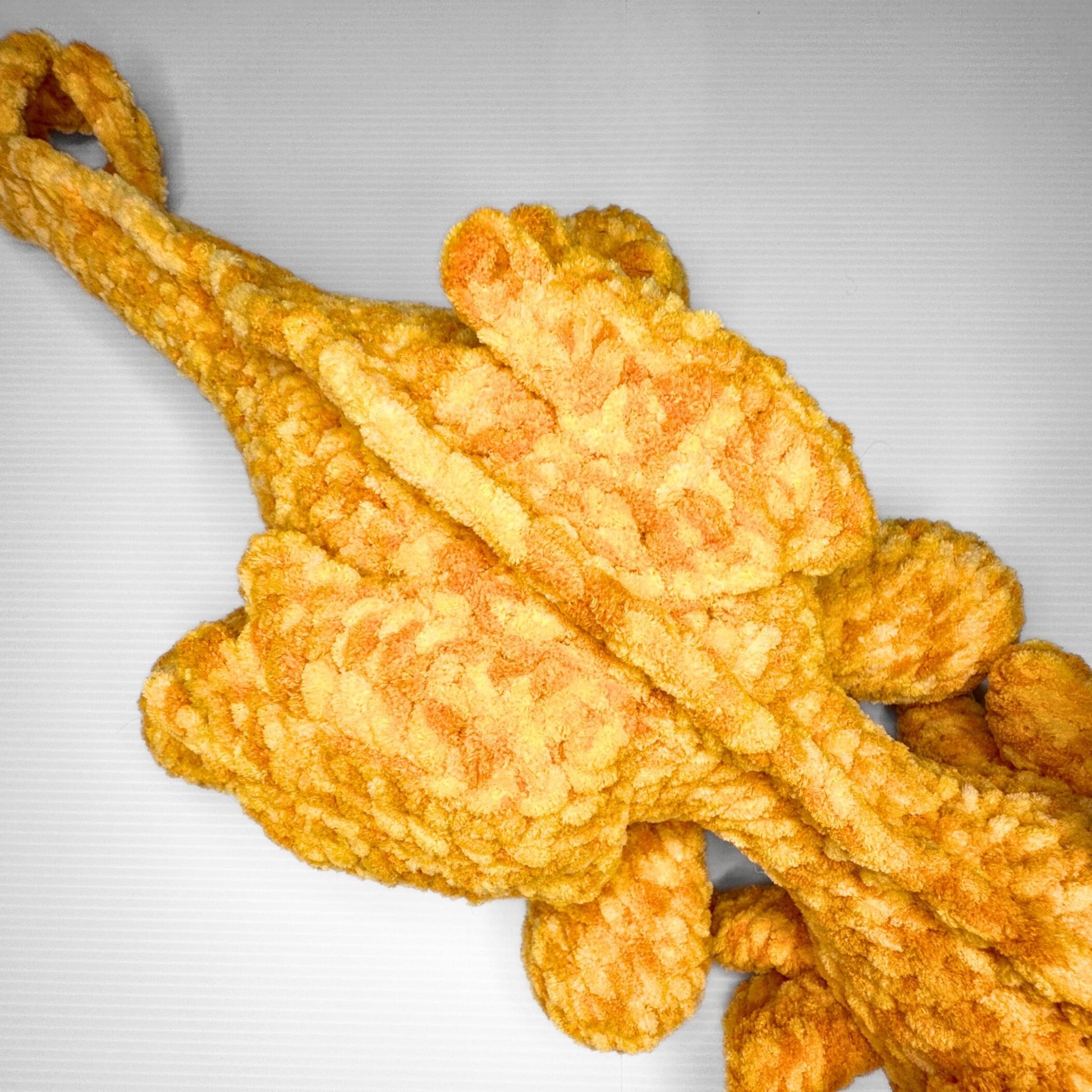 Handmade Golden Feathertail Dragon Crochet Plush — Large Laying Fantasy Dragon in Warm Gold Velvet Yarn - pursuitofcraftyness