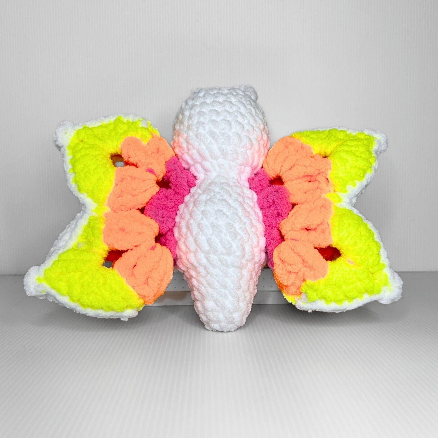Handmade Granny Square Butterfly Crochet Plush — Neon Multicolor Patterned Wings in Chunky Yarn - pursuitofcraftyness