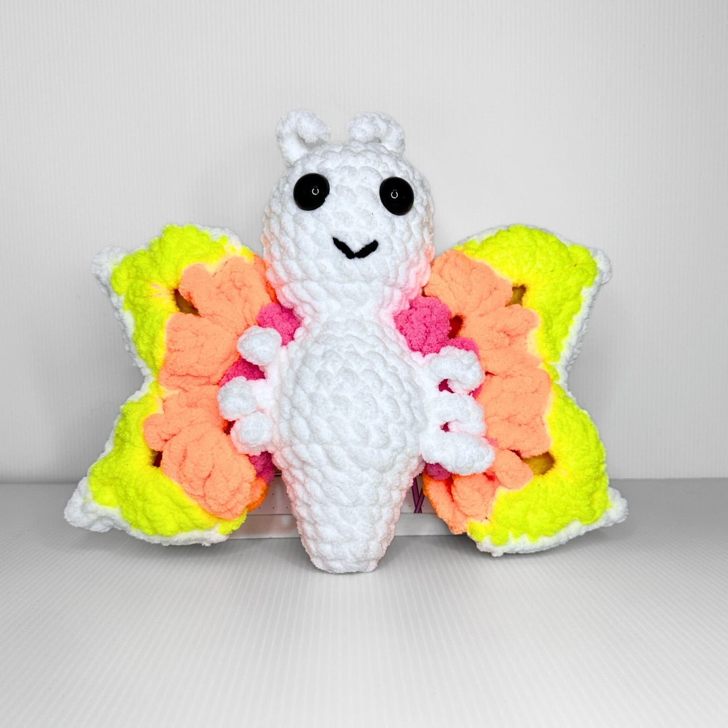 Handmade Granny Square Butterfly Crochet Plush — Neon Multicolor Patterned Wings in Chunky Yarn - pursuitofcraftyness