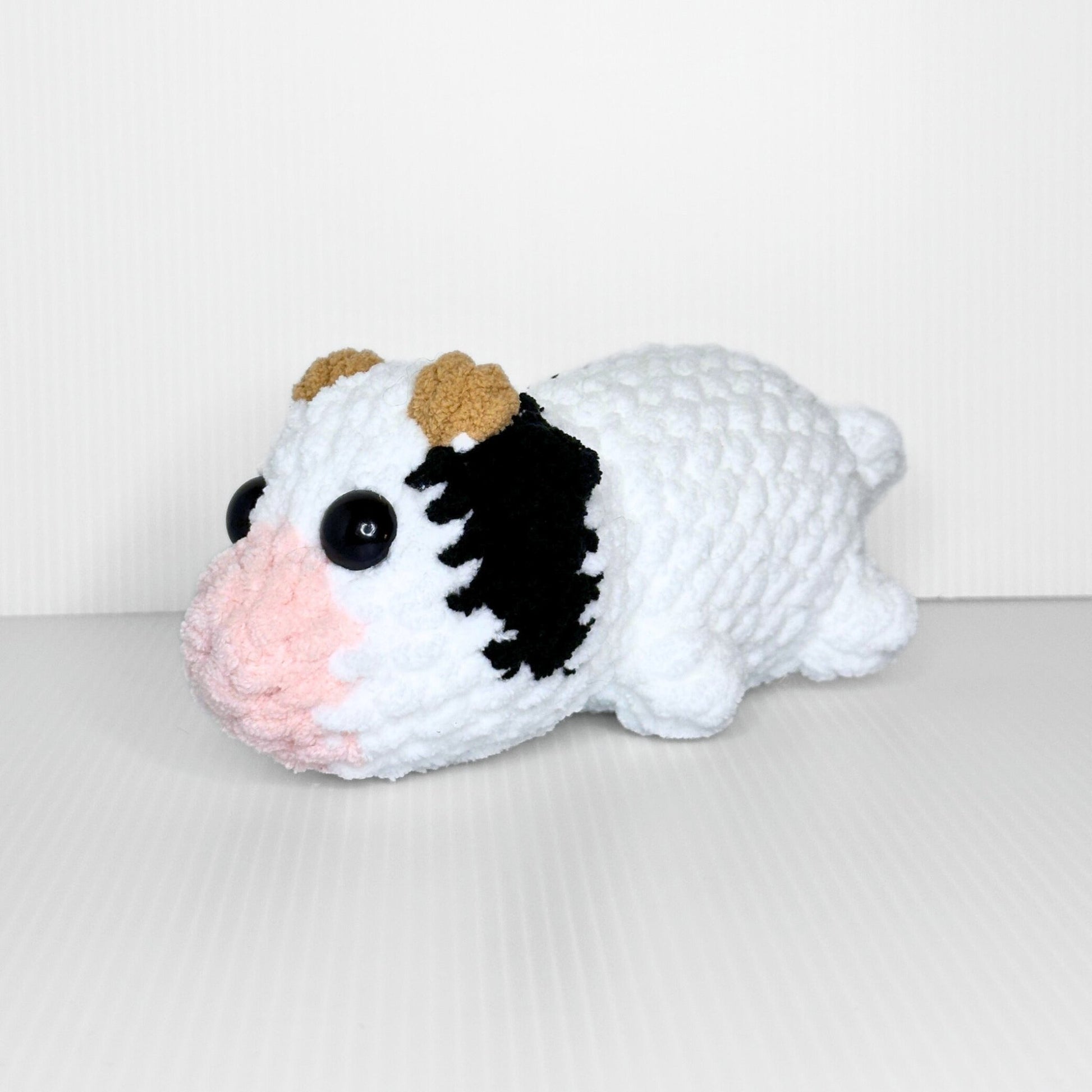 Handmade Sleepy Cow Crochet Plush — Laying Down Black and White Chunky Chenille Stuffed Animal - pursuitofcraftyness