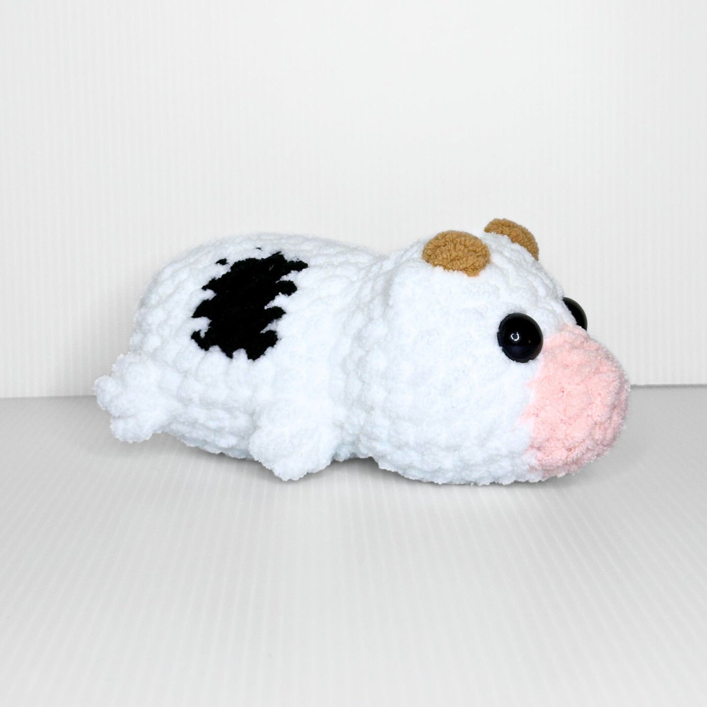 Handmade Sleepy Cow Crochet Plush — Laying Down Black and White Chunky Chenille Stuffed Animal - pursuitofcraftyness